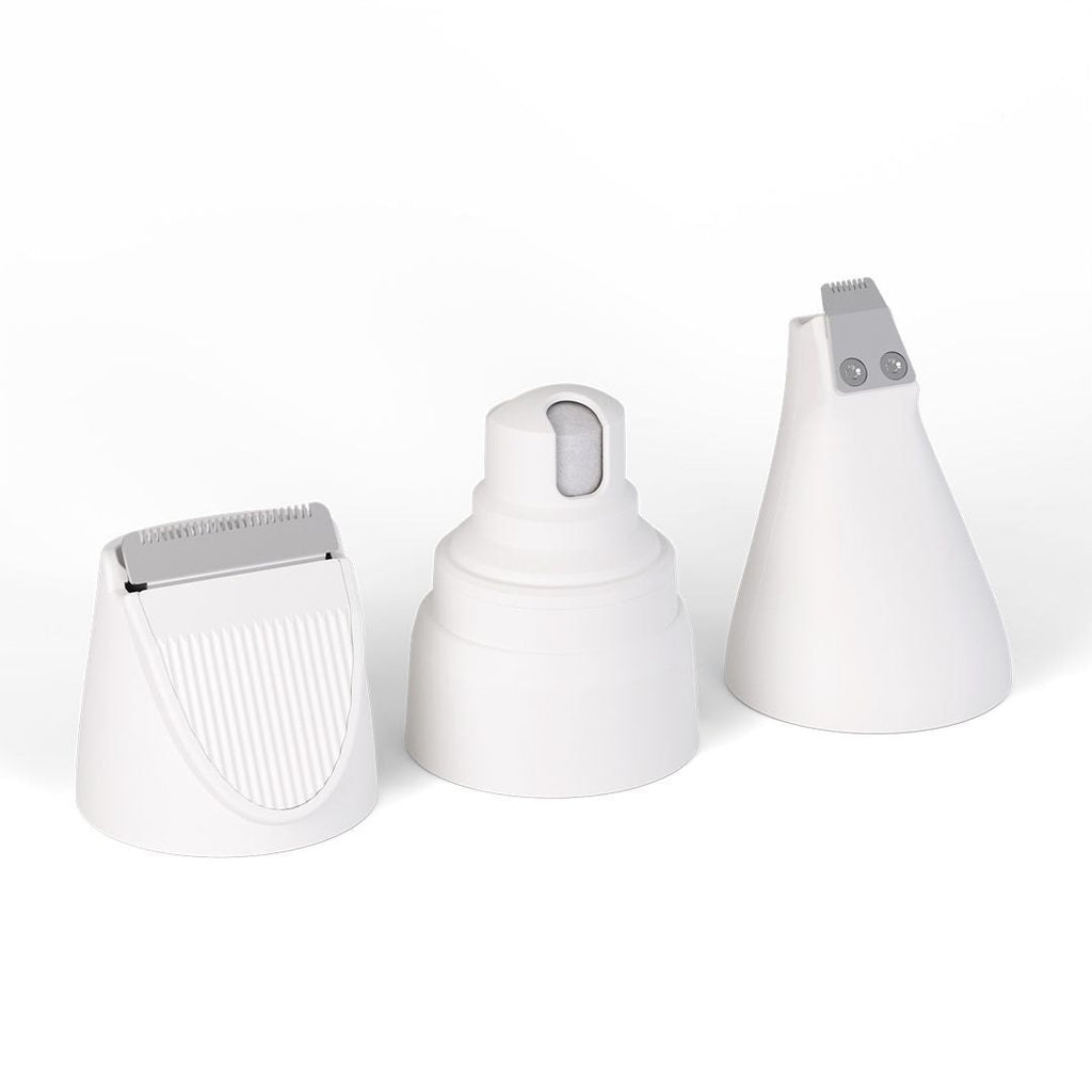 White grooming-kit trimmer attachments on a light background