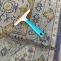 Lint tool lifting pet hair from fabric
