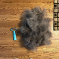 Deshedder brush and collected loose coat